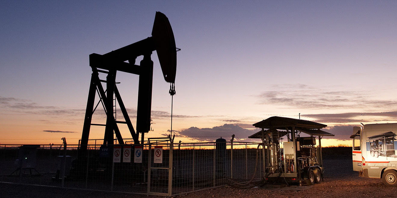 Oil and gas pump at the well Oil and gas pump at the well at night