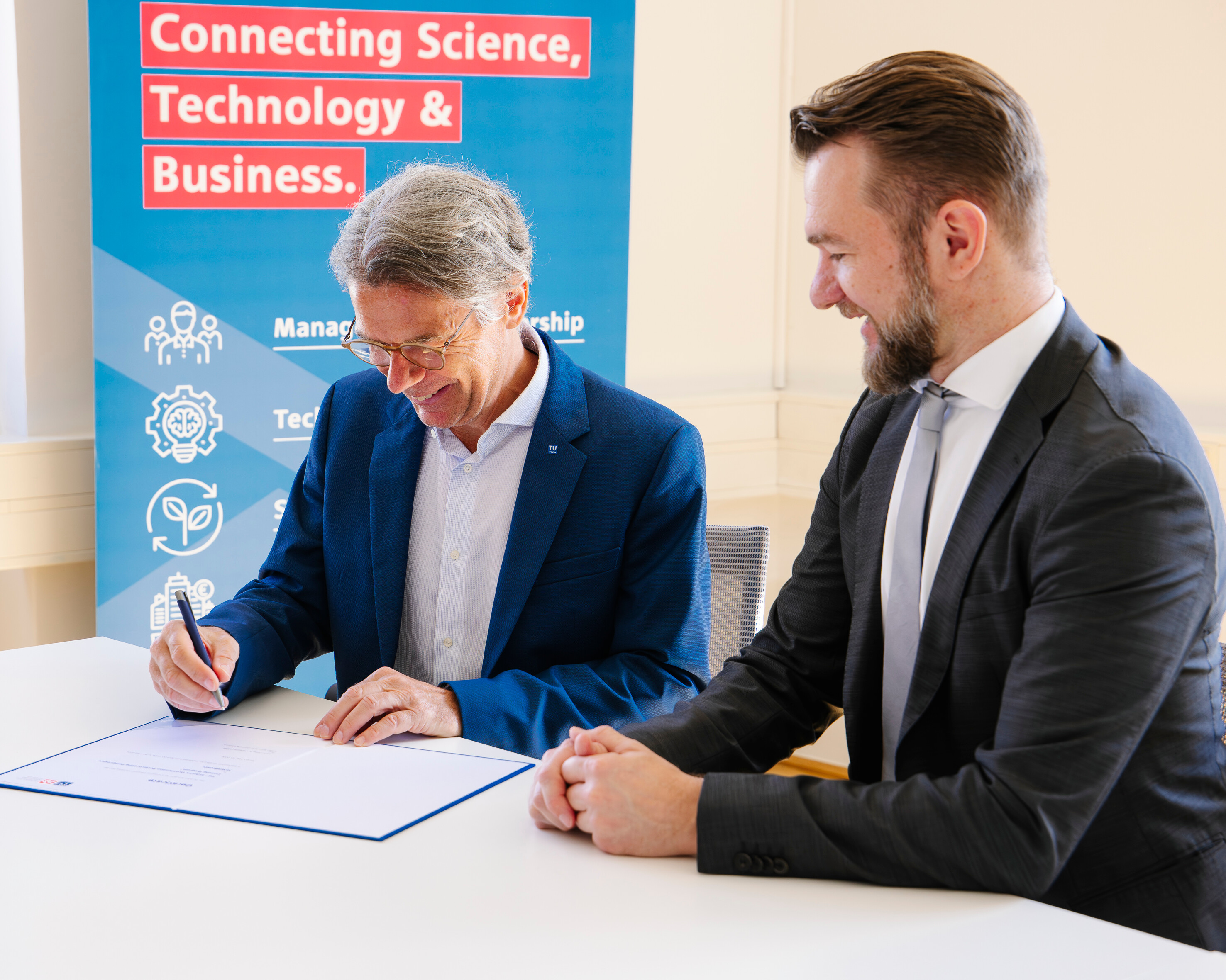 Dean of TU Wien signing the certificate