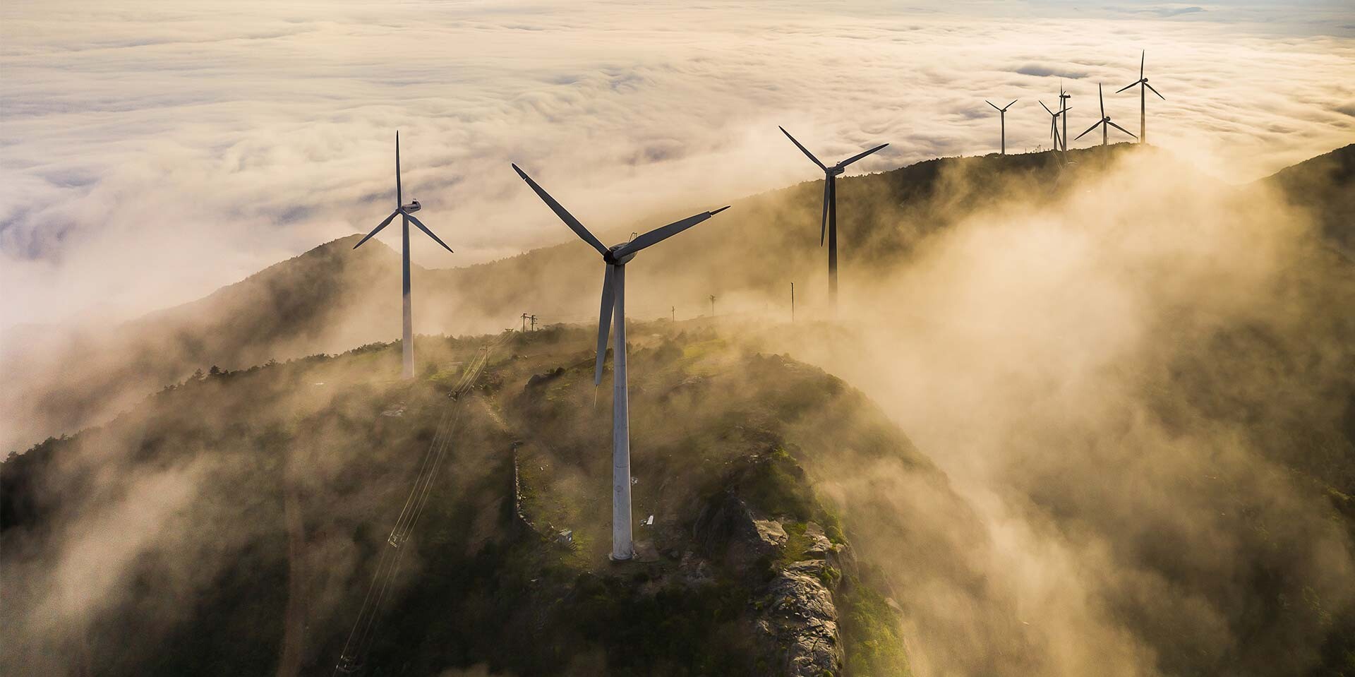 Windturbines on cloudy hill Windturbines on cloudy hill